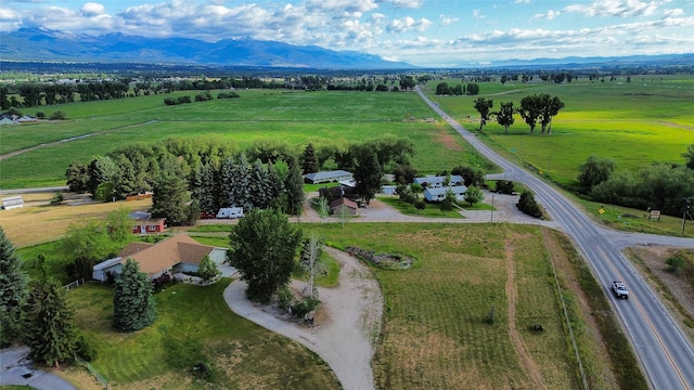 drone / aerial view featuring a mountain view and a rural view