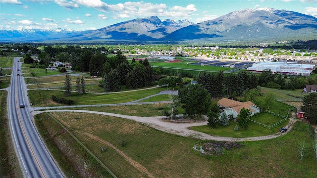 birds eye view of property featuring a mountain view