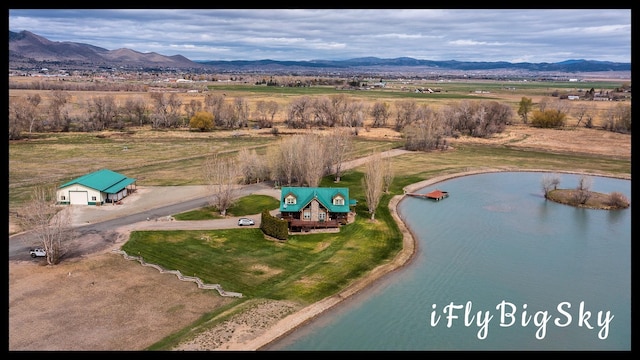 aerial view with a rural view and a water and mountain view