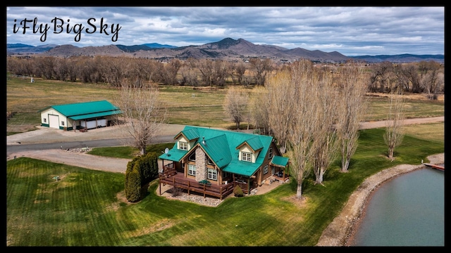 drone / aerial view featuring a mountain view and a rural view