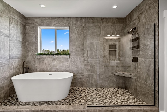 bathroom with plus walk in shower and tile walls