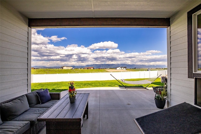 view of patio with a mountain view and an outdoor hangout area