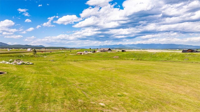 exterior space with a mountain view and a rural view