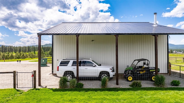 view of outbuilding featuring a lawn