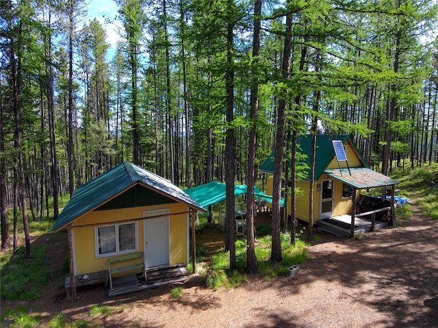 NHN W Ashby Creek Rd, Potomac, MT 59823 - view of outdoor structure featuring a wooded view