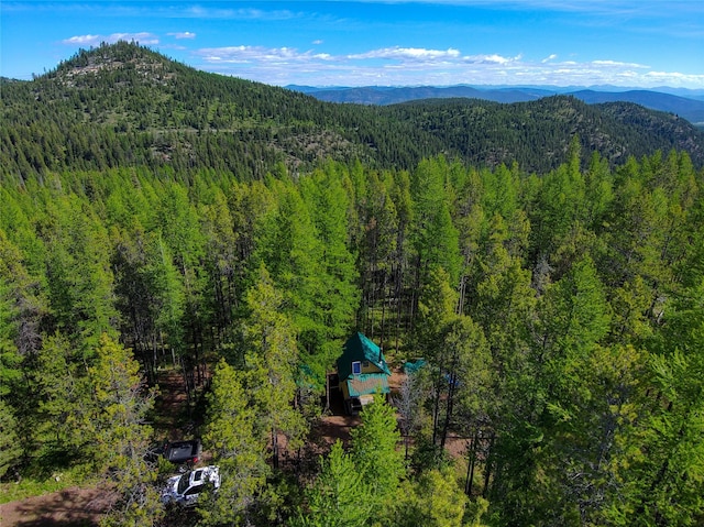 exterior space with a forest view