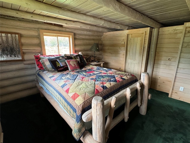 bedroom with wood ceiling, rustic walls, and dark colored carpet