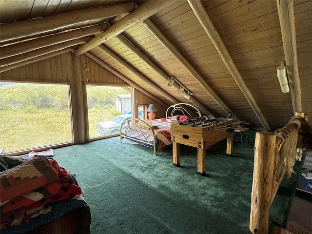 interior space with wooden ceiling, carpet flooring, rail lighting, and vaulted ceiling with beams