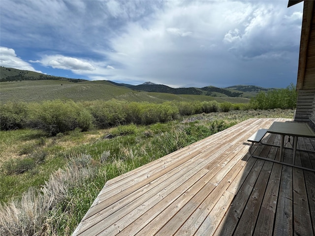 wooden terrace featuring a mountain view