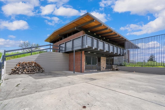 exterior space with brick siding