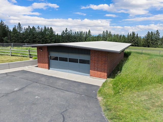 garage with fence