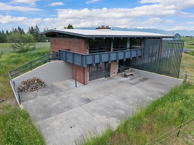 view of front of home featuring brick siding