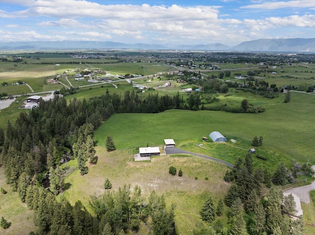 birds eye view of property featuring a mountain view and a rural view