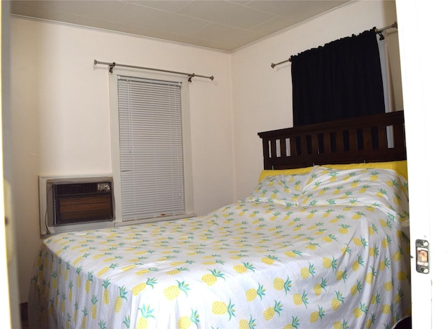 bedroom with a wall mounted air conditioner