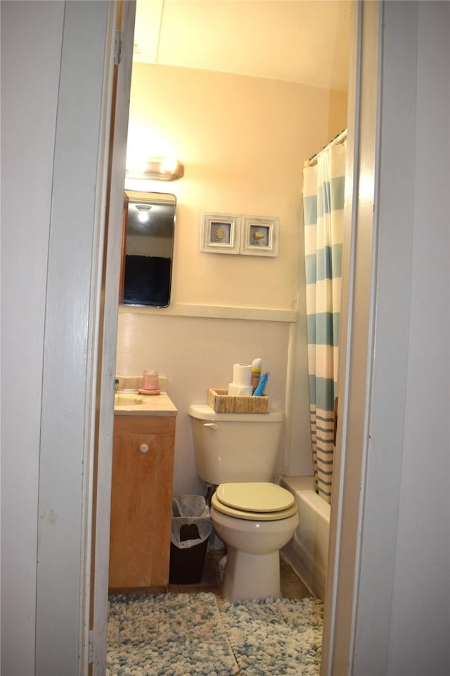 bathroom with tile patterned floors, vanity, and toilet