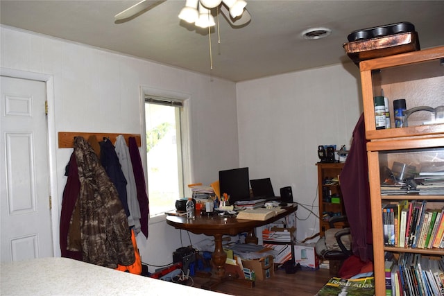 home office with ceiling fan and dark hardwood / wood-style floors