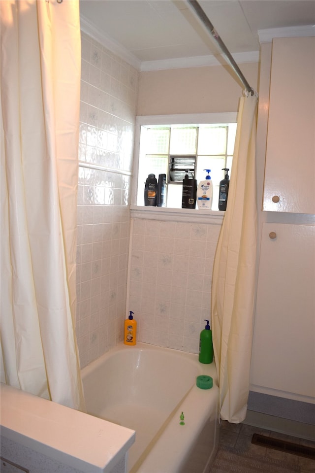 full bath with crown molding and shower / bath combination with curtain