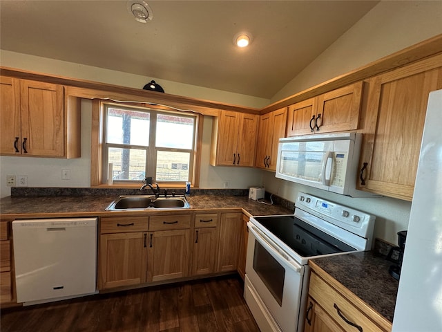 kitchen featuring lofted ceiling, white appliances, sink, and dark hardwood / wood-style flooring