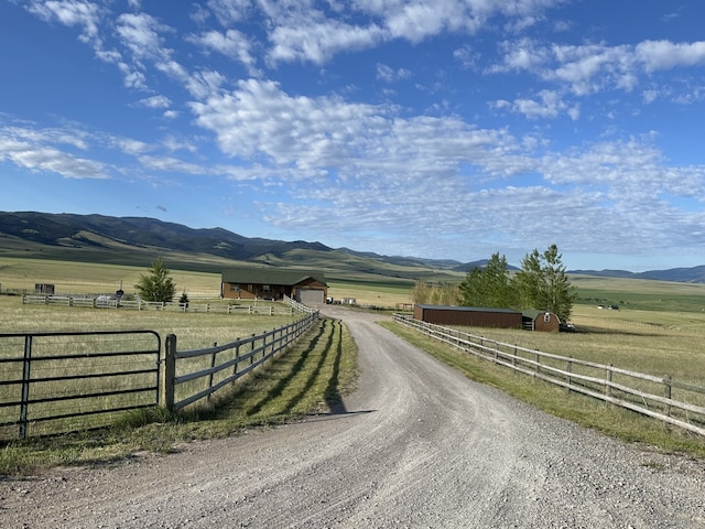 view of street with a mountain view and a rural view