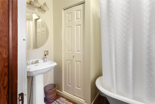 bathroom featuring a tub to relax in