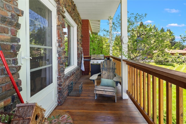 balcony featuring area for grilling