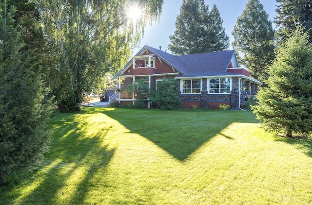 back of house with a yard