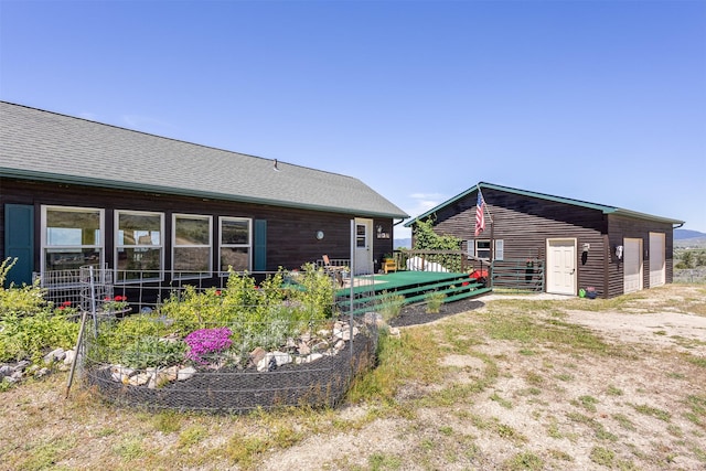 3851 Reed Butte Rd, Stevensville, MT 59870 - view of yard with a garage and a wooden deck