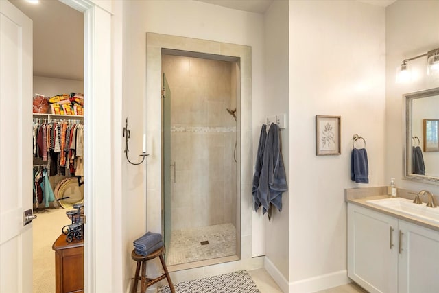 bathroom featuring vanity and a shower with door