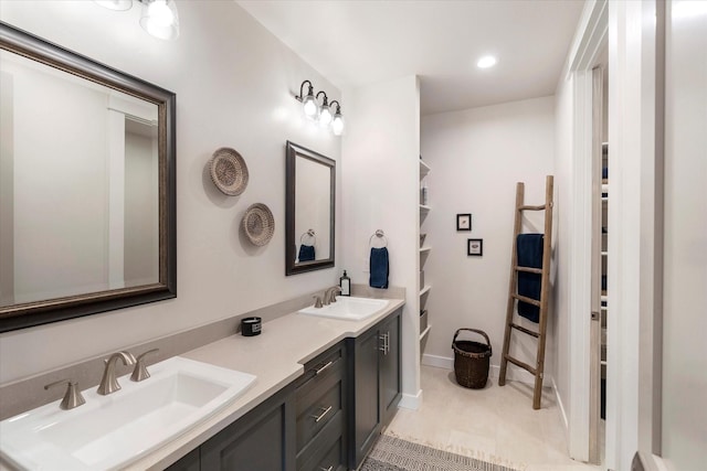 bathroom with tile patterned flooring and vanity