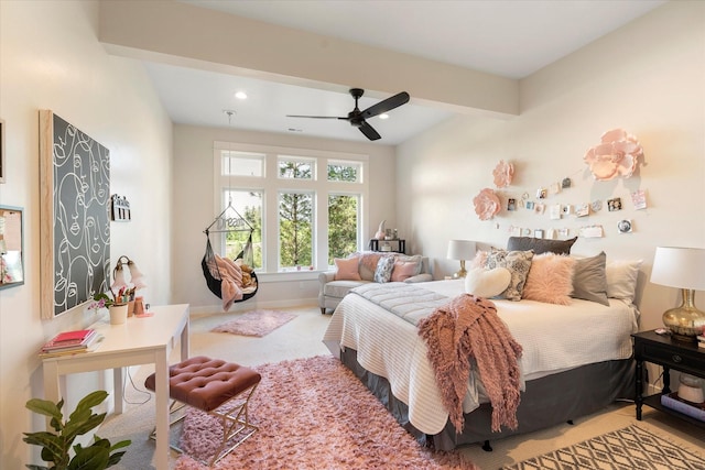 bedroom with ceiling fan, carpet flooring, and beam ceiling