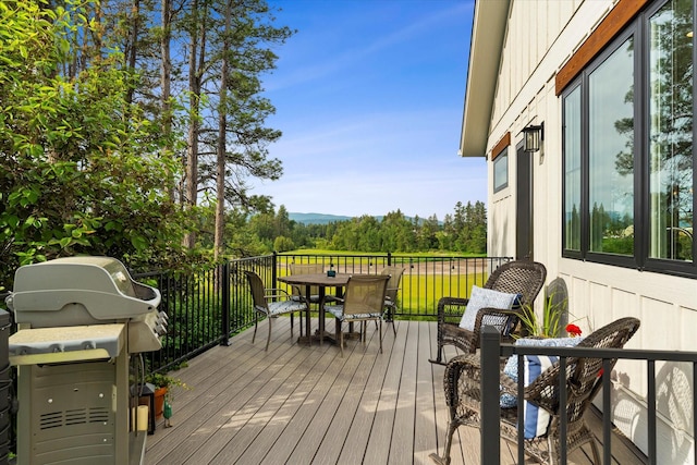 wooden deck featuring grilling area