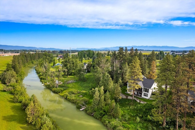 aerial view featuring a water and mountain view