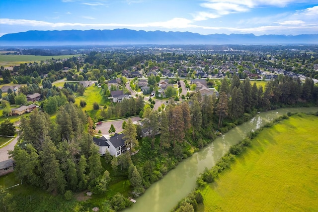 aerial view featuring a water and mountain view