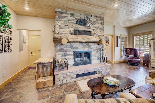 tiled living room with a stone fireplace and wood ceiling