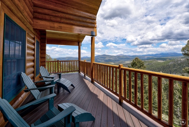 wooden deck with a mountain view