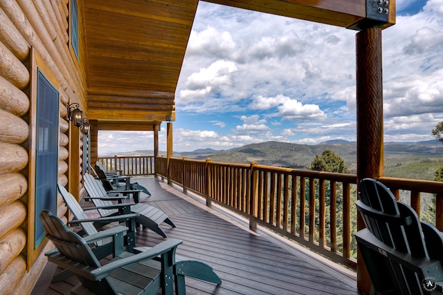 wooden terrace featuring a mountain view