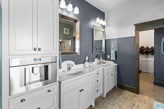 full bathroom with visible vents, a sink, and double vanity