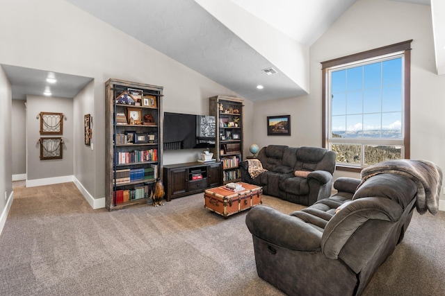 living room featuring lofted ceiling, light colored carpet, and baseboards