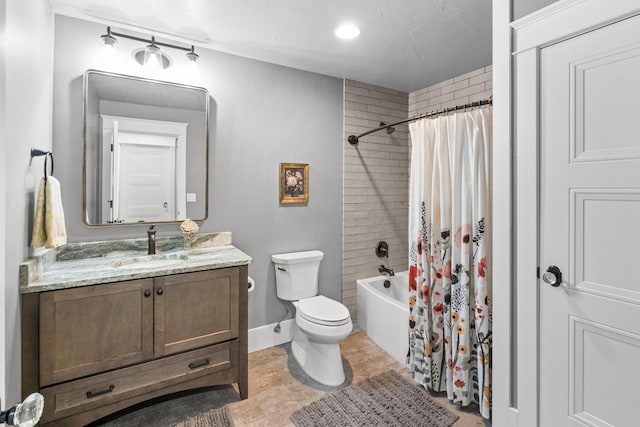 bathroom featuring toilet, shower / bathtub combination with curtain, baseboards, and vanity