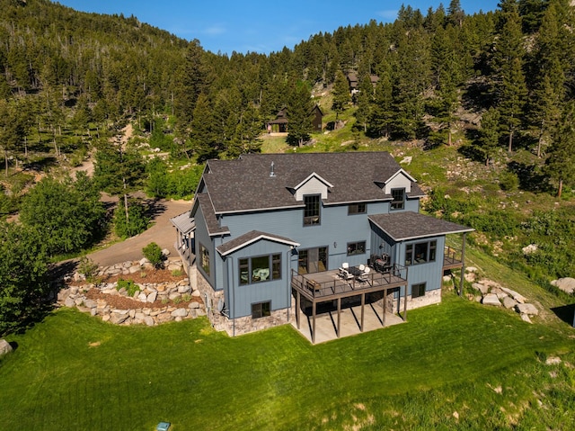 aerial view featuring a wooded view