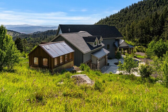 birds eye view of property with a mountain view