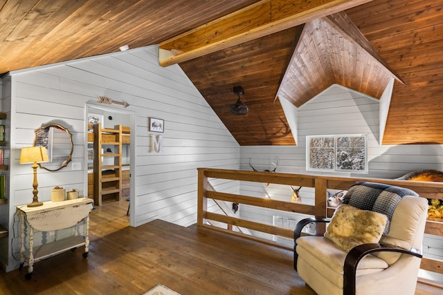 sitting room featuring vaulted ceiling with beams, wood ceiling, wood walls, an upstairs landing, and wood finished floors