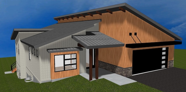 116 Golden Bear Dr, Bigfork, MT 59911 - view of front of house with stone siding and a standing seam roof