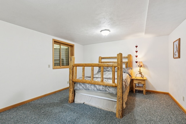 carpeted bedroom with a textured ceiling