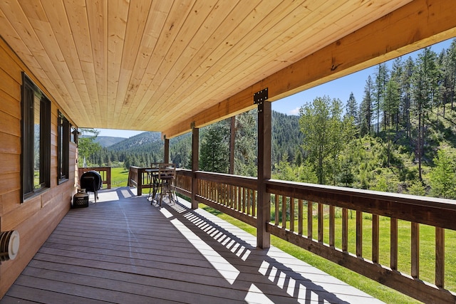 wooden deck with a yard