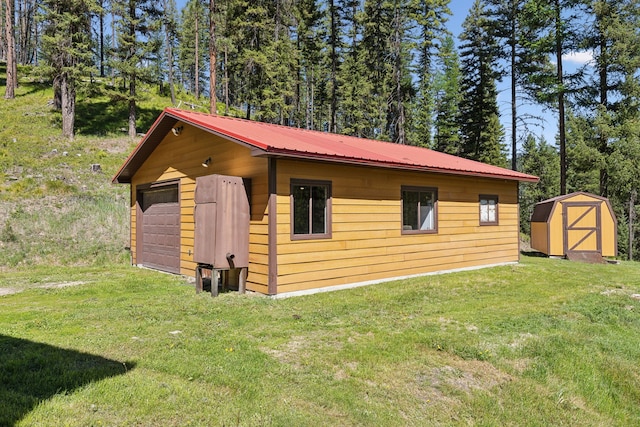 view of shed / structure with a yard