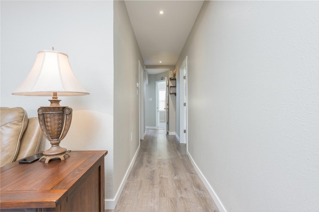 hall with light wood-type flooring