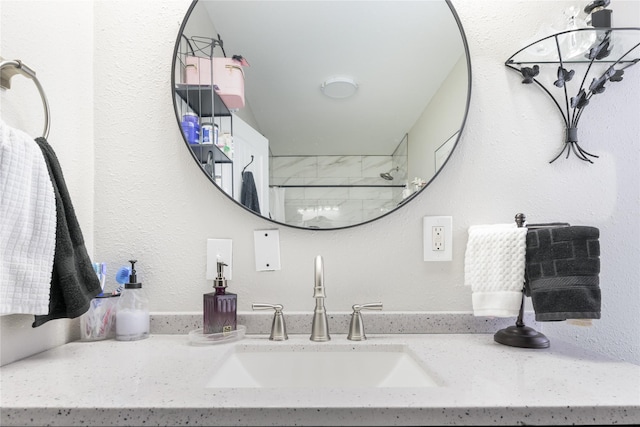 bathroom with vanity and a shower