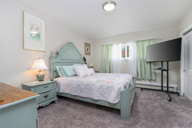 bedroom with carpet floors and a baseboard heating unit