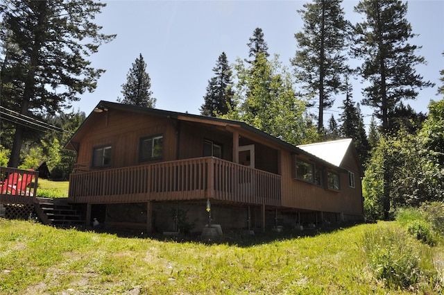 rear view of house with a wooden deck